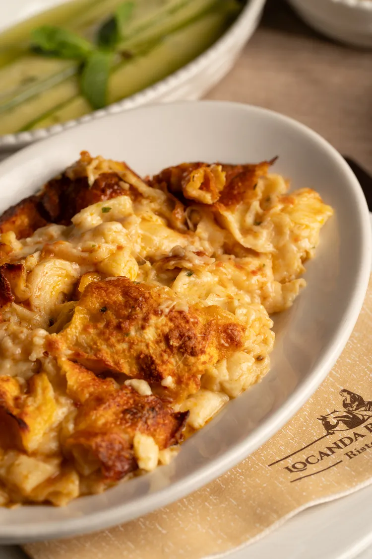 Baked pasta au gratin, golden and gooey